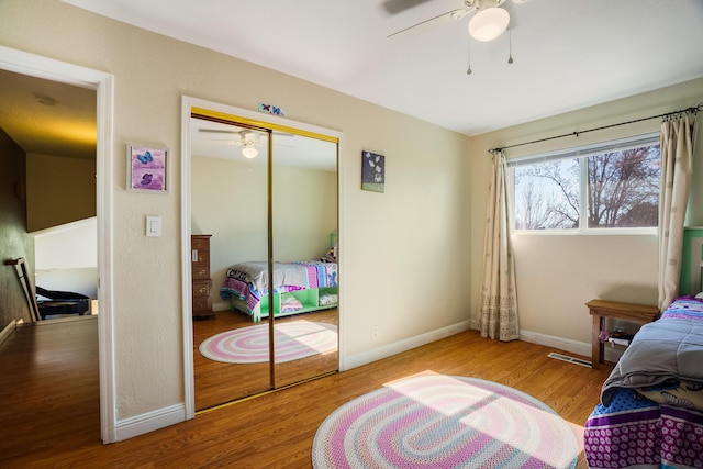 bedroom featuring a closet, ceiling fan, and light hardwood / wood-style flooring