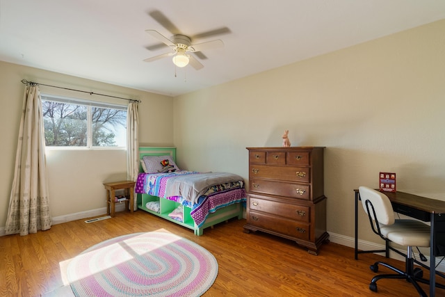 bedroom featuring wood-type flooring and ceiling fan