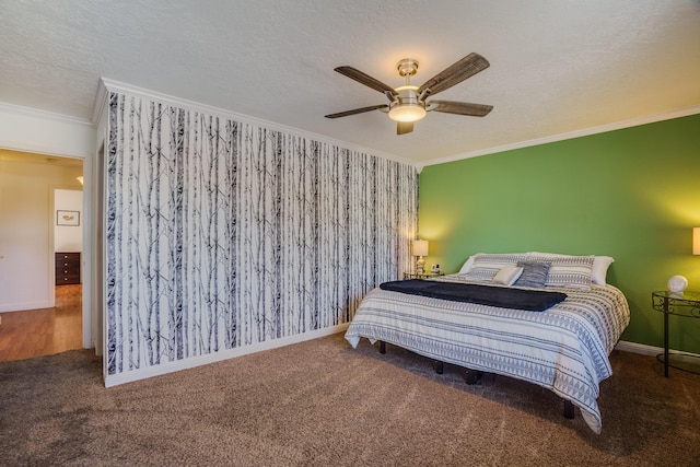 bedroom with ornamental molding, carpet floors, ceiling fan, and a textured ceiling