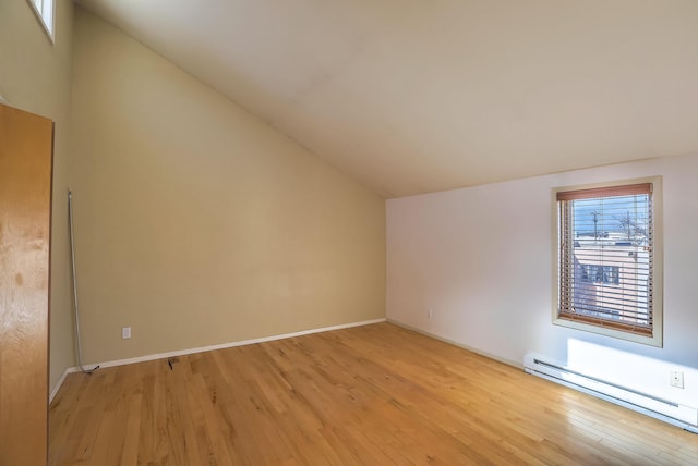 bonus room with lofted ceiling, light wood-type flooring, and baseboard heating