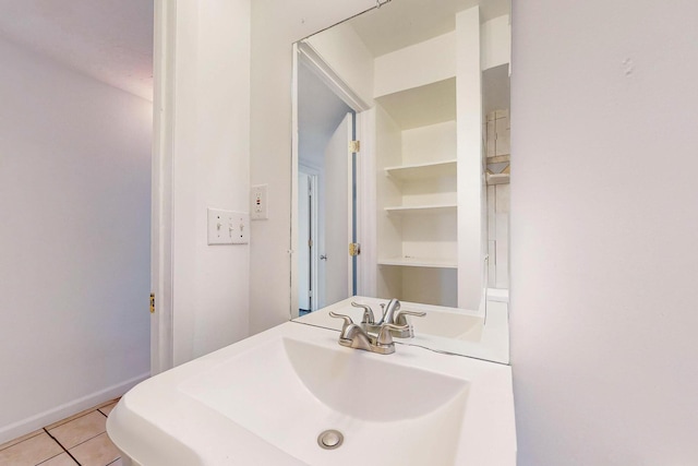 bathroom with sink and tile patterned flooring