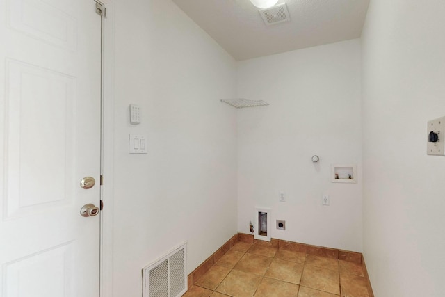 washroom featuring hookup for a washing machine, gas dryer hookup, hookup for an electric dryer, and light tile patterned flooring