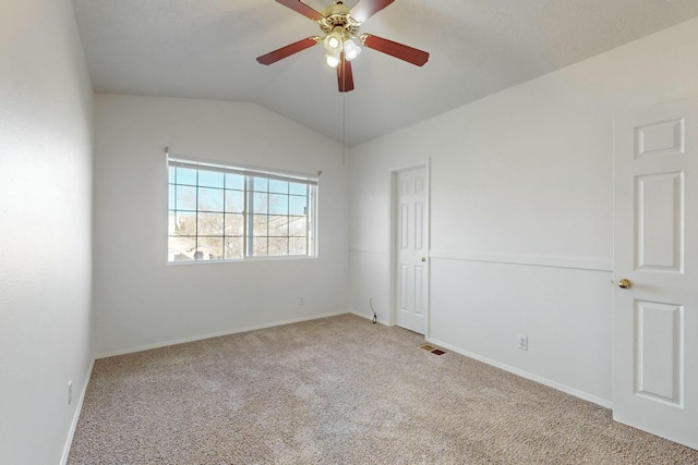 unfurnished room featuring light carpet, lofted ceiling, and ceiling fan