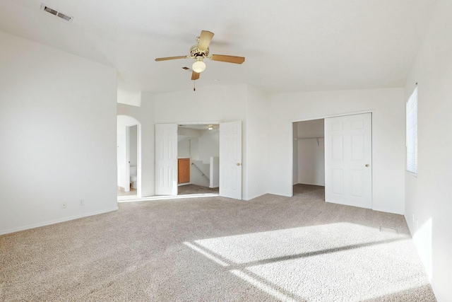 unfurnished bedroom featuring carpet floors, a closet, and ceiling fan