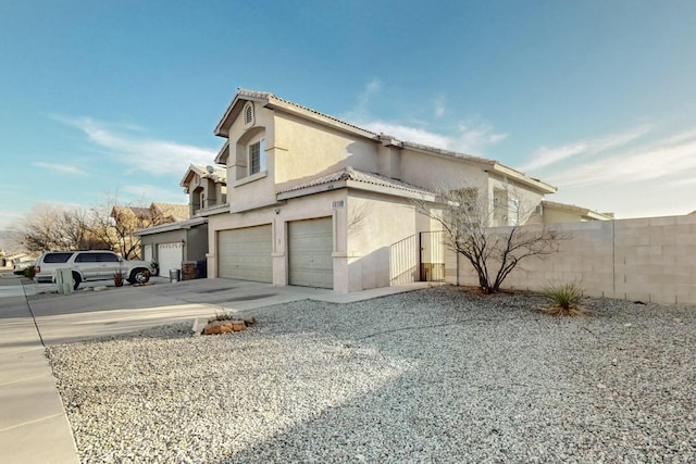 view of property exterior with a garage