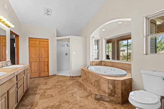 full bathroom with vanity, independent shower and bath, and toilet