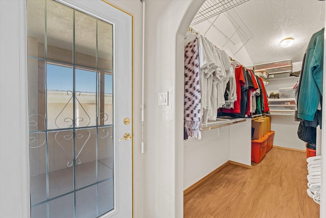 spacious closet featuring light wood-type flooring