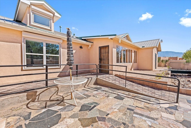 view of patio / terrace featuring a mountain view