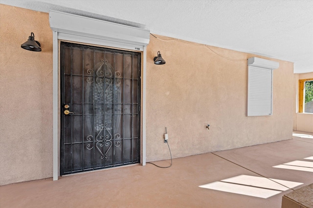 entrance to property with a wall mounted air conditioner