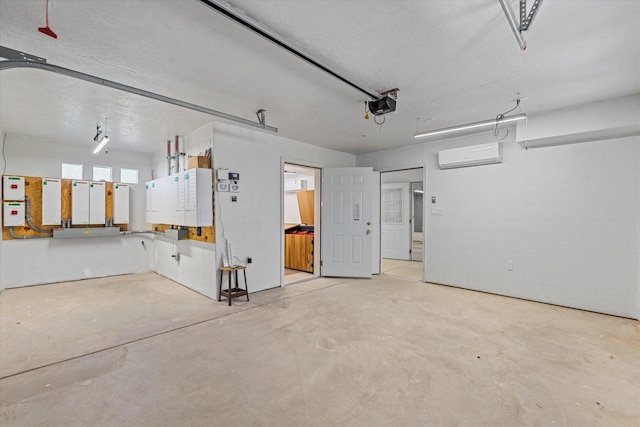 garage featuring a garage door opener and a wall mounted air conditioner