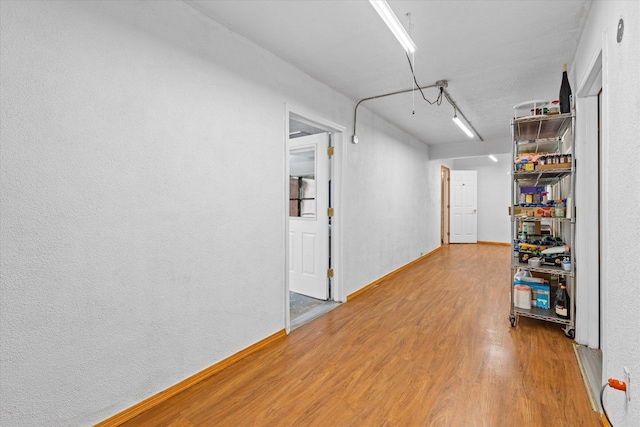 hallway featuring hardwood / wood-style flooring