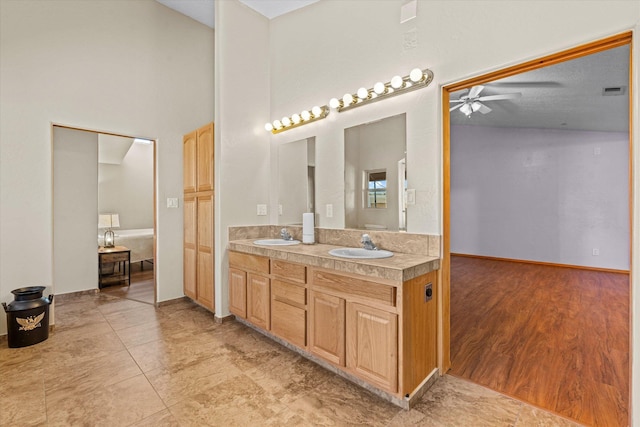 bathroom with vanity, hardwood / wood-style floors, and ceiling fan