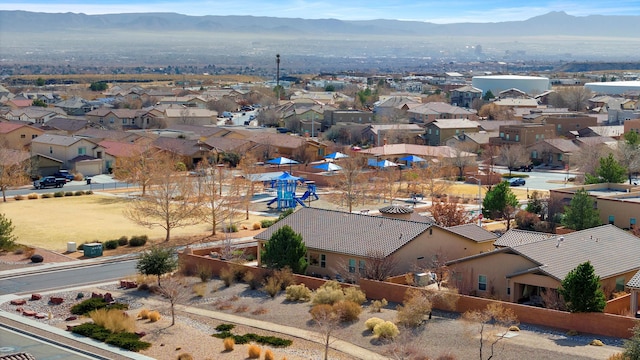 birds eye view of property with a mountain view