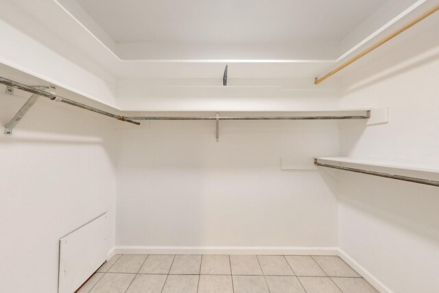 walk in closet featuring light tile patterned floors