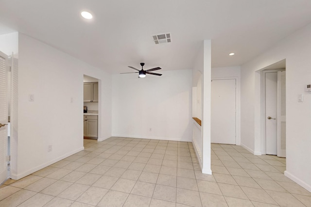 spare room with light tile patterned floors and ceiling fan