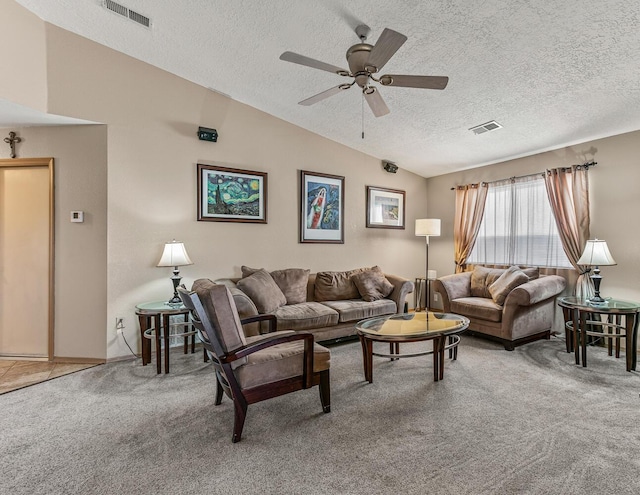 carpeted living room with ceiling fan, lofted ceiling, and a textured ceiling