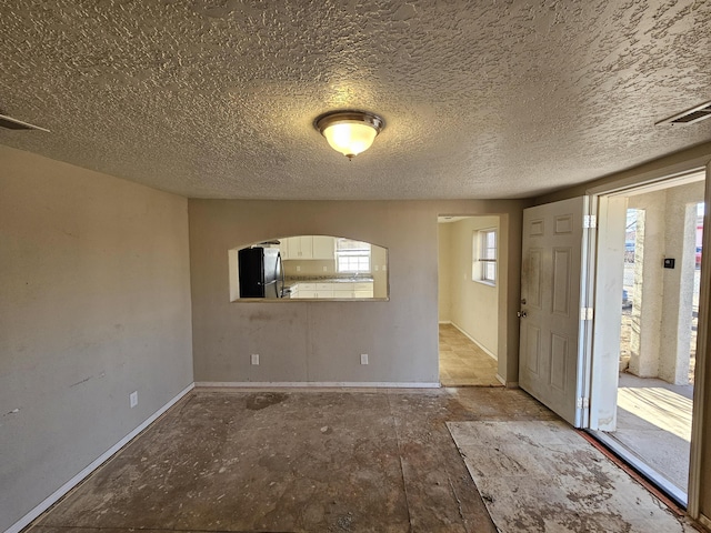 entrance foyer featuring a textured ceiling