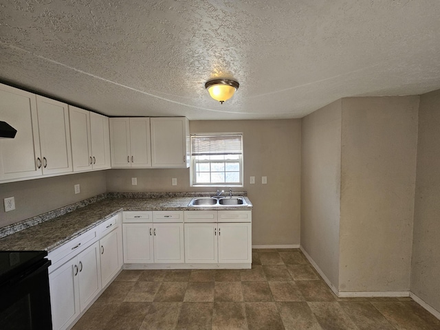 kitchen with white cabinetry, sink, a textured ceiling, and black electric range oven