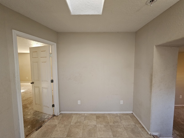 spare room featuring a textured ceiling