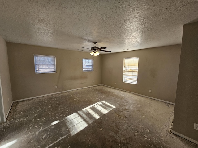 spare room featuring ceiling fan and a textured ceiling