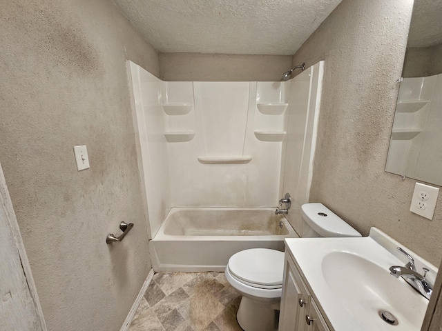 full bathroom featuring vanity, bathtub / shower combination, a textured ceiling, and toilet