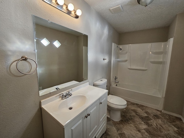 full bathroom with vanity, a textured ceiling, toilet, and shower / bathing tub combination