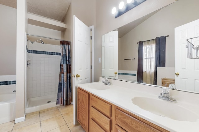 bathroom with lofted ceiling, tile patterned floors, shower with separate bathtub, a textured ceiling, and vanity