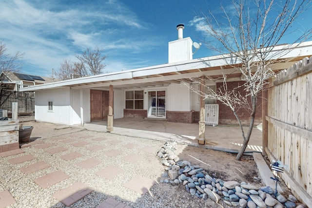 rear view of house with a patio