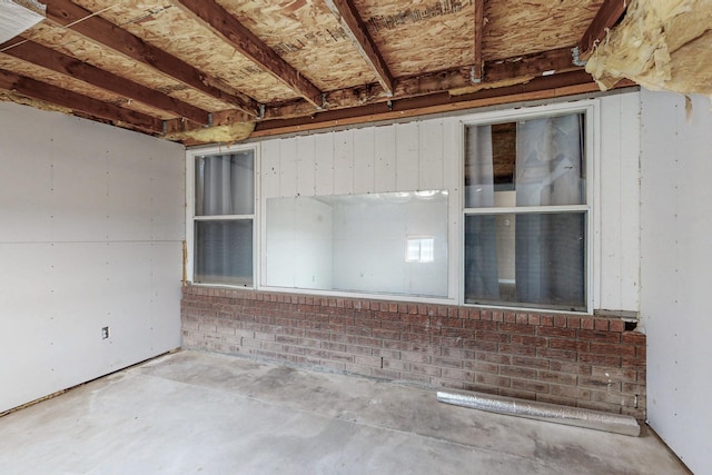 spare room with concrete floors