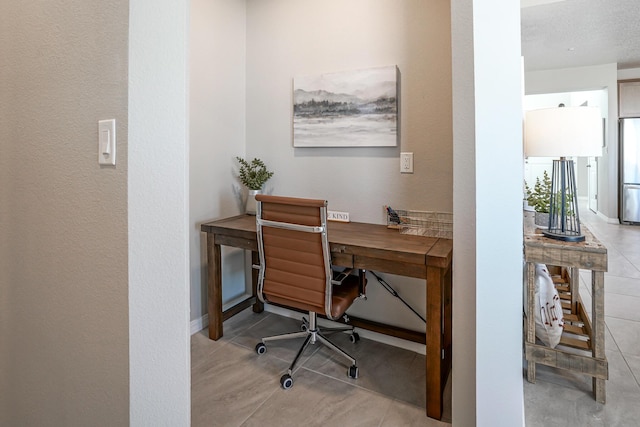 office space with tile patterned flooring