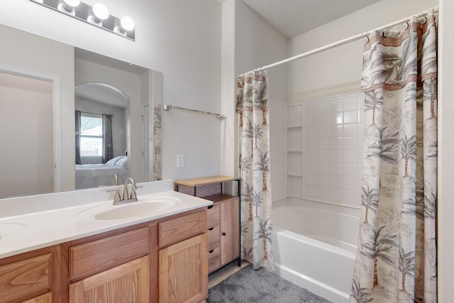 bathroom with vanity and shower / bath combo