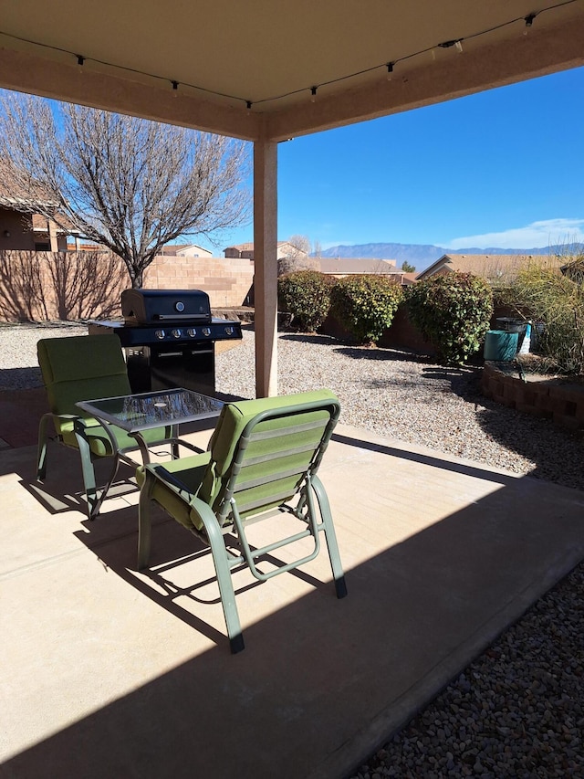 view of patio featuring a mountain view and a grill