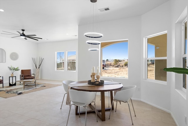 1145 15th St SE, Rio Rancho, NM 87124 - dining room with light tile patterned floors and ceiling fan
