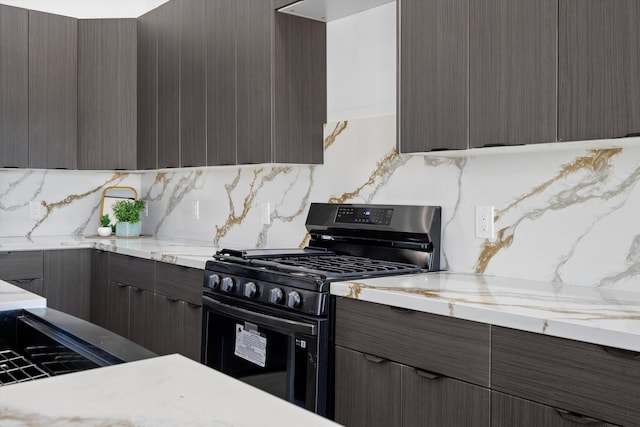 1145 15th St SE, Rio Rancho, NM 87124 - kitchen with tasteful backsplash and gas range