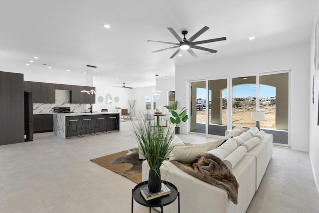 1145 15th St SE, Rio Rancho, NM 87124 - living room featuring ceiling fan and sink