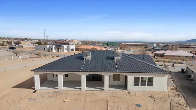 1145 15th St SE, Rio Rancho, NM 87124 - rear view of property with a patio area