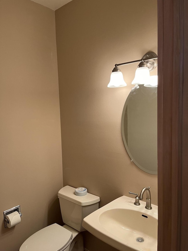 bathroom featuring sink and toilet