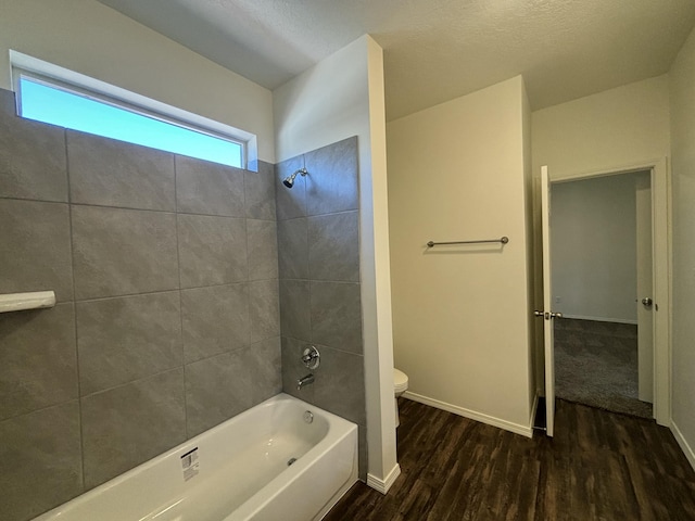 6232 Winter Hawk Dr NE, Rio Rancho, NM 87144 - full bathroom with shower / tub combination, toilet, wood finished floors, and baseboards