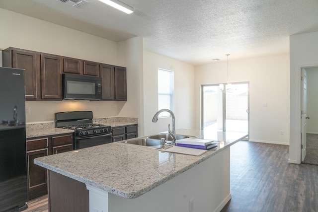 6232 Winter Hawk Dr NE, Rio Rancho, NM 87144 - kitchen with black appliances, a sink, dark brown cabinets, dark wood-style flooring, and hanging light fixtures
