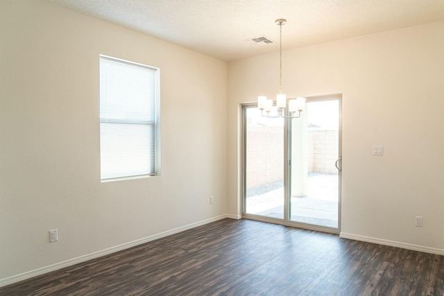 6232 Winter Hawk Dr NE, Rio Rancho, NM 87144 - unfurnished room featuring a chandelier, plenty of natural light, and visible vents