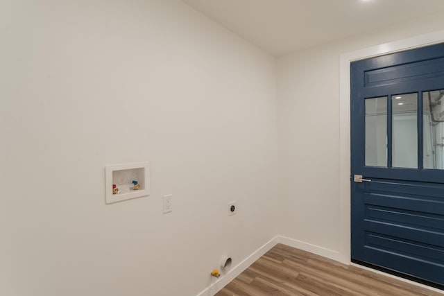 washroom with washer hookup, hookup for a gas dryer, wood-type flooring, and electric dryer hookup