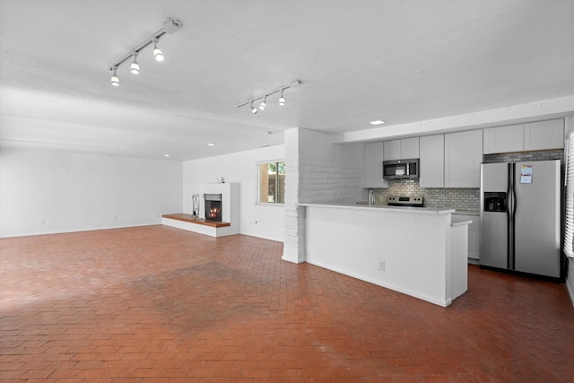 kitchen featuring backsplash and appliances with stainless steel finishes