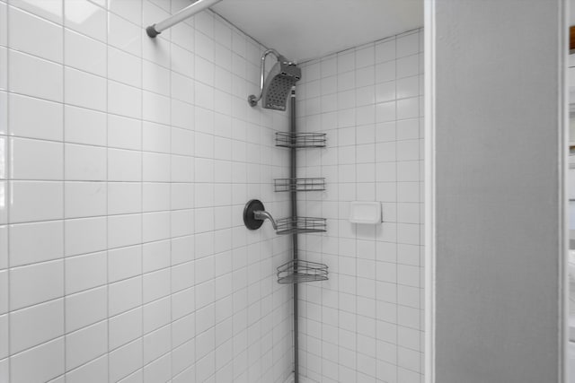 bathroom with tiled shower