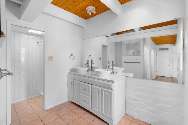 bathroom featuring beamed ceiling, wood ceiling, vanity, and tile patterned flooring