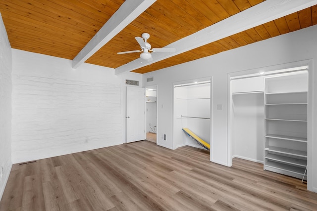 unfurnished bedroom with beamed ceiling, wood ceiling, and light hardwood / wood-style flooring