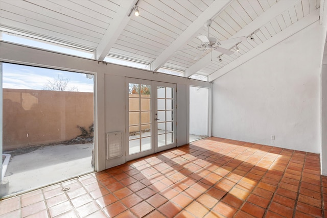 interior space featuring rail lighting, vaulted ceiling with beams, wooden ceiling, and french doors