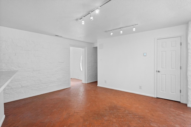 empty room featuring a textured ceiling