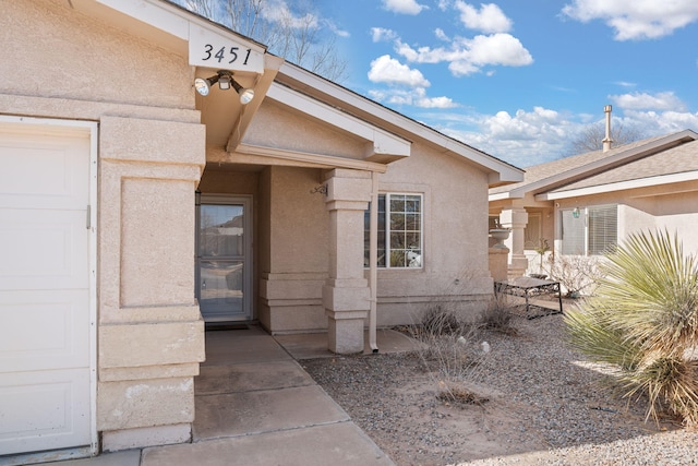 property entrance featuring a garage