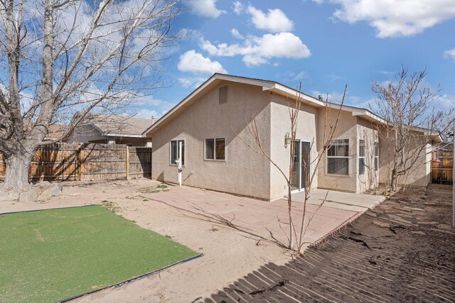 back of house featuring a patio