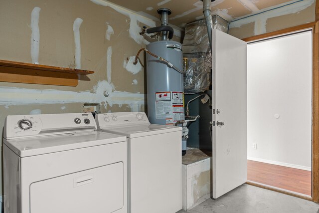 laundry room featuring independent washer and dryer and water heater